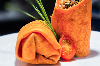 A plate of a wrap sandwhich.